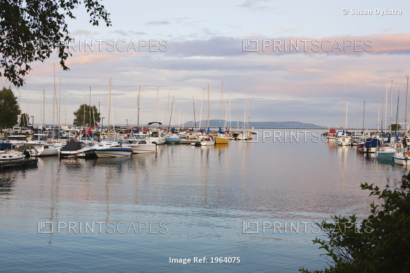 Boats In The Harbour At Sunset