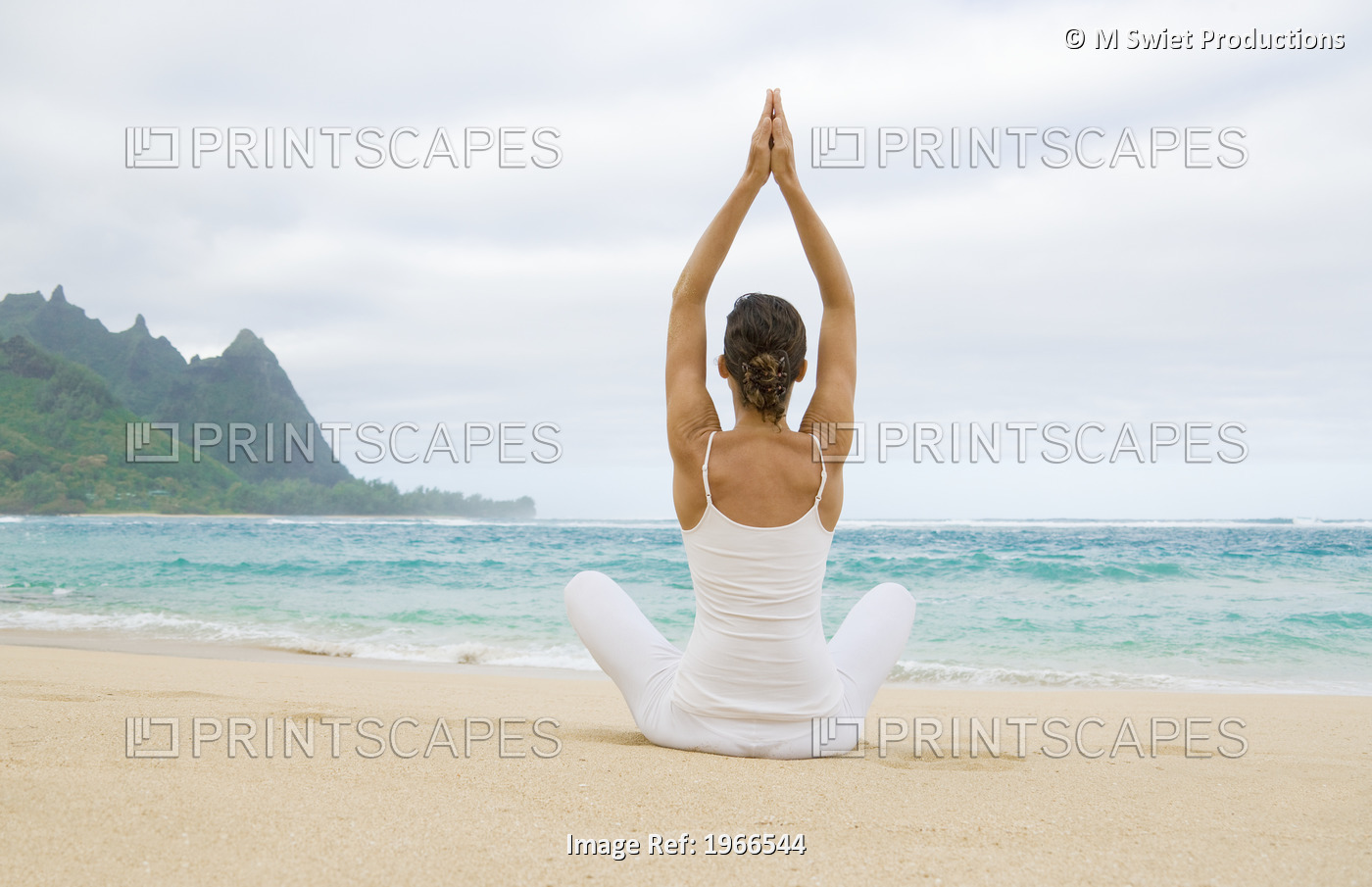 Hawaii, Kauai, Haena Beach Tunnels Beach, Woman Meditating On Sandy Shore.