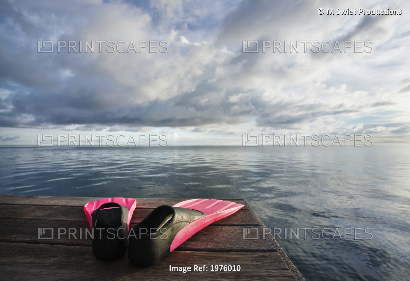 Hawaii, Pink Fins On Dock At Sunset.