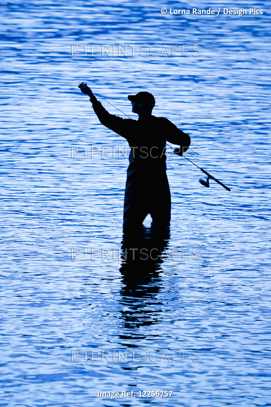 Silhouette Of A Man Fishing In The River; Surrey, British Columbia, Canada