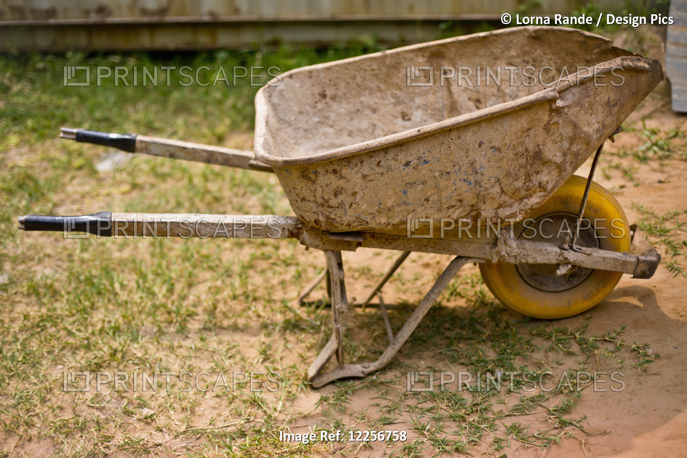 A Worn And Weathered Wheelbarrow At The Construction Site Of The Iranzi Clinic; ...