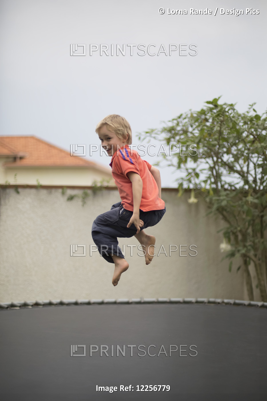 Young Boy Jumping On A Trampoline; Kigali, Rwanda