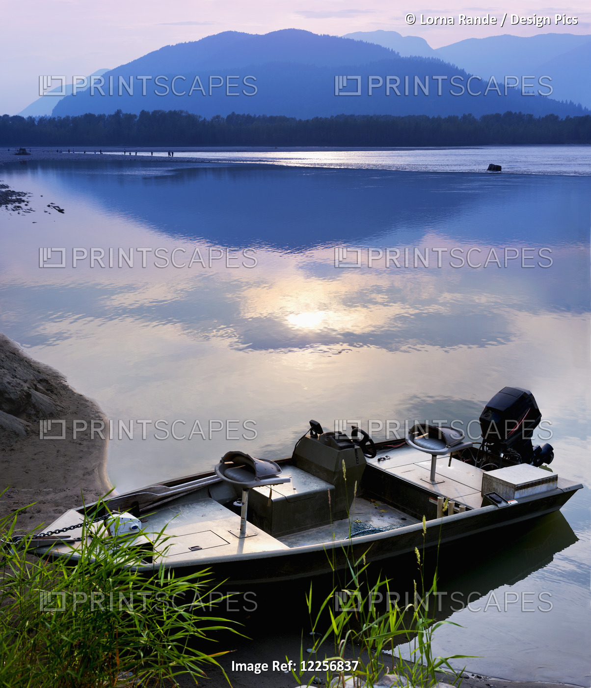 Boat Moored On The Peg Leg Bar At Sunset; Chilliwack, British Columbia, Canada