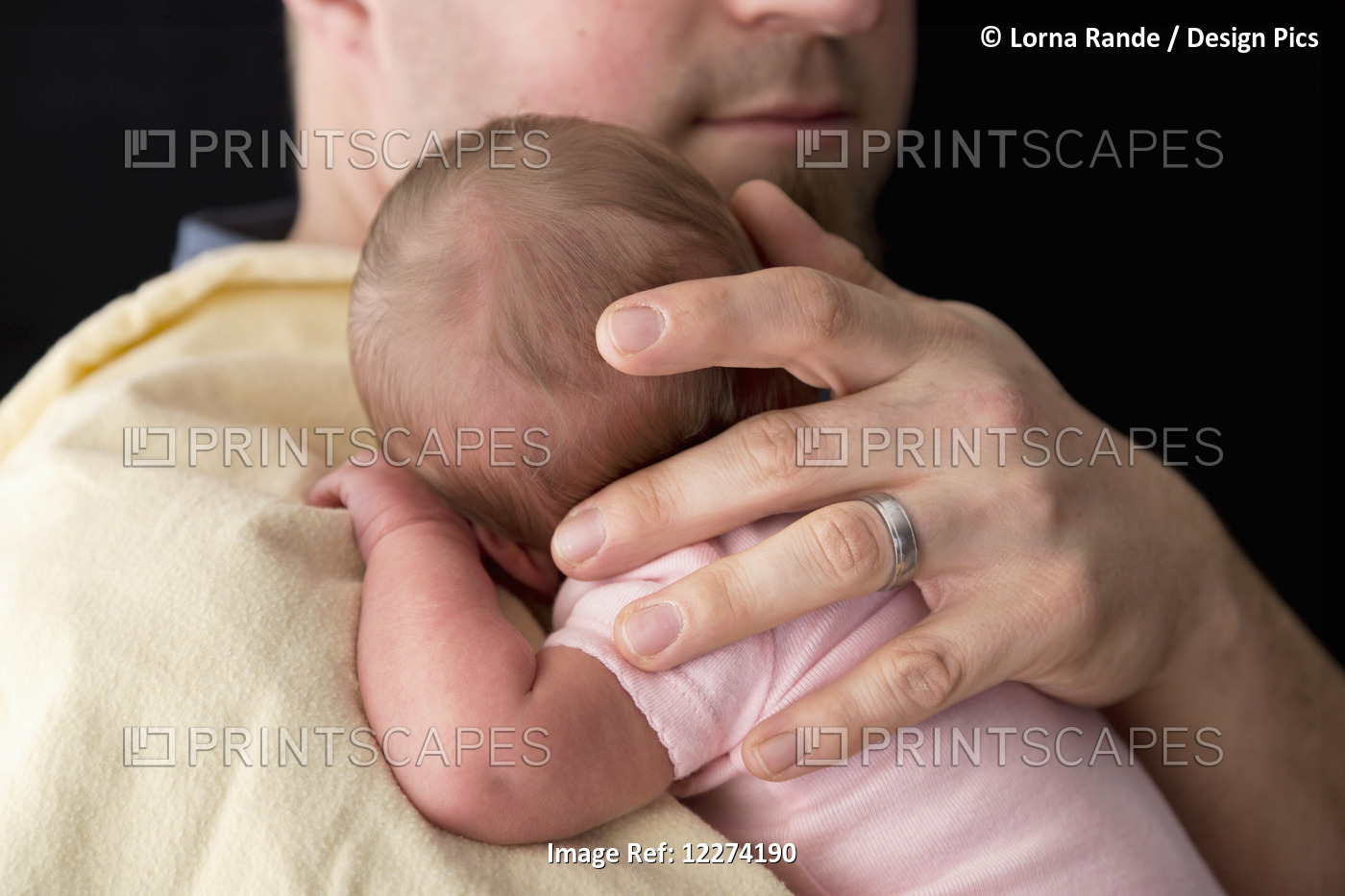 A Father Holds Her Newborn Daughter; Chilliwack, British Columbia, Canada