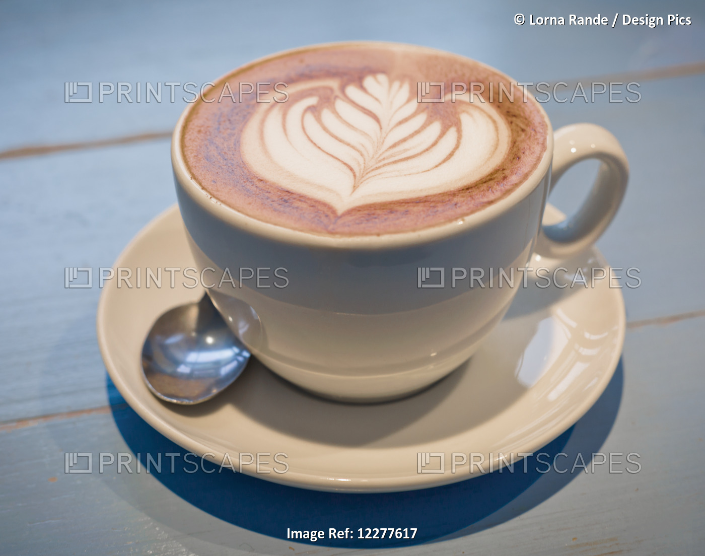 Hot Drink With Leaf Design In Milk On Surface; Vancouver, British Columbia, ...