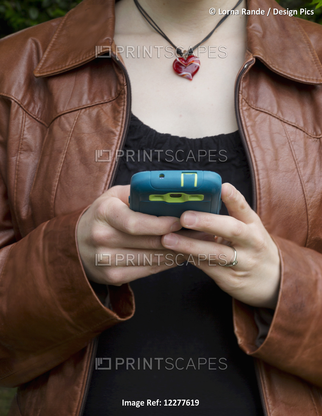 Woman Using Her Smart Phone; Surrey, British Columbia, Canada