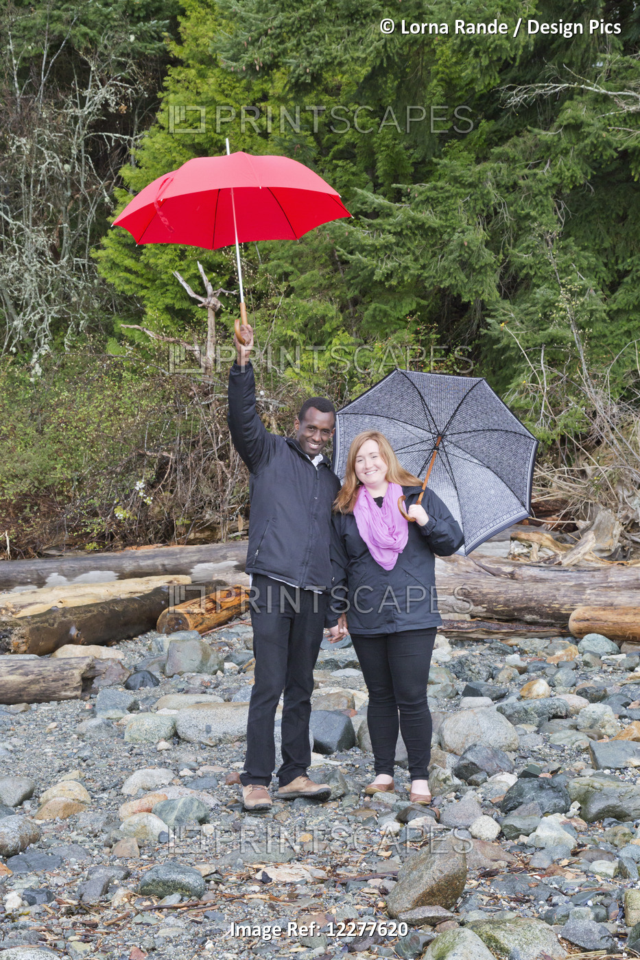 A Couple Posing With Umbrellas In Whytecliff Park, Horseshoe Bay; British ...