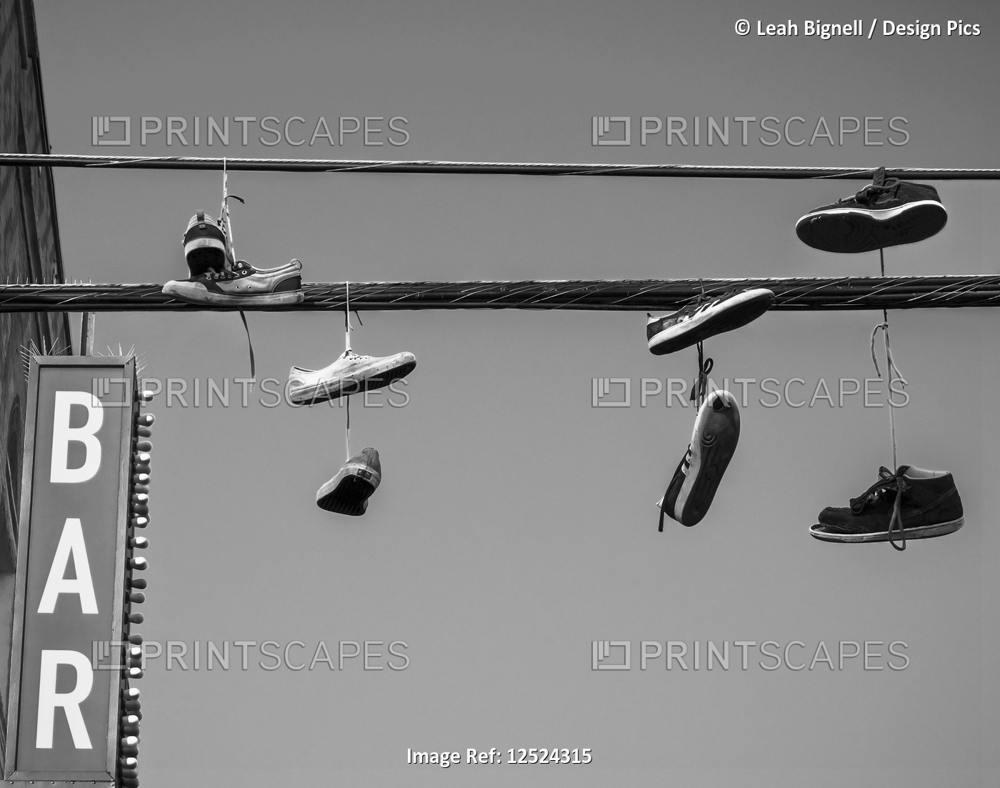 Shoes dangling from the wires about the Venice Beach Boardwalk, Los Angeles, CA.