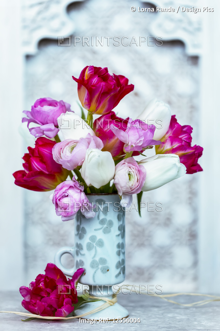 Bouquet of colourful flowers in a decorative container