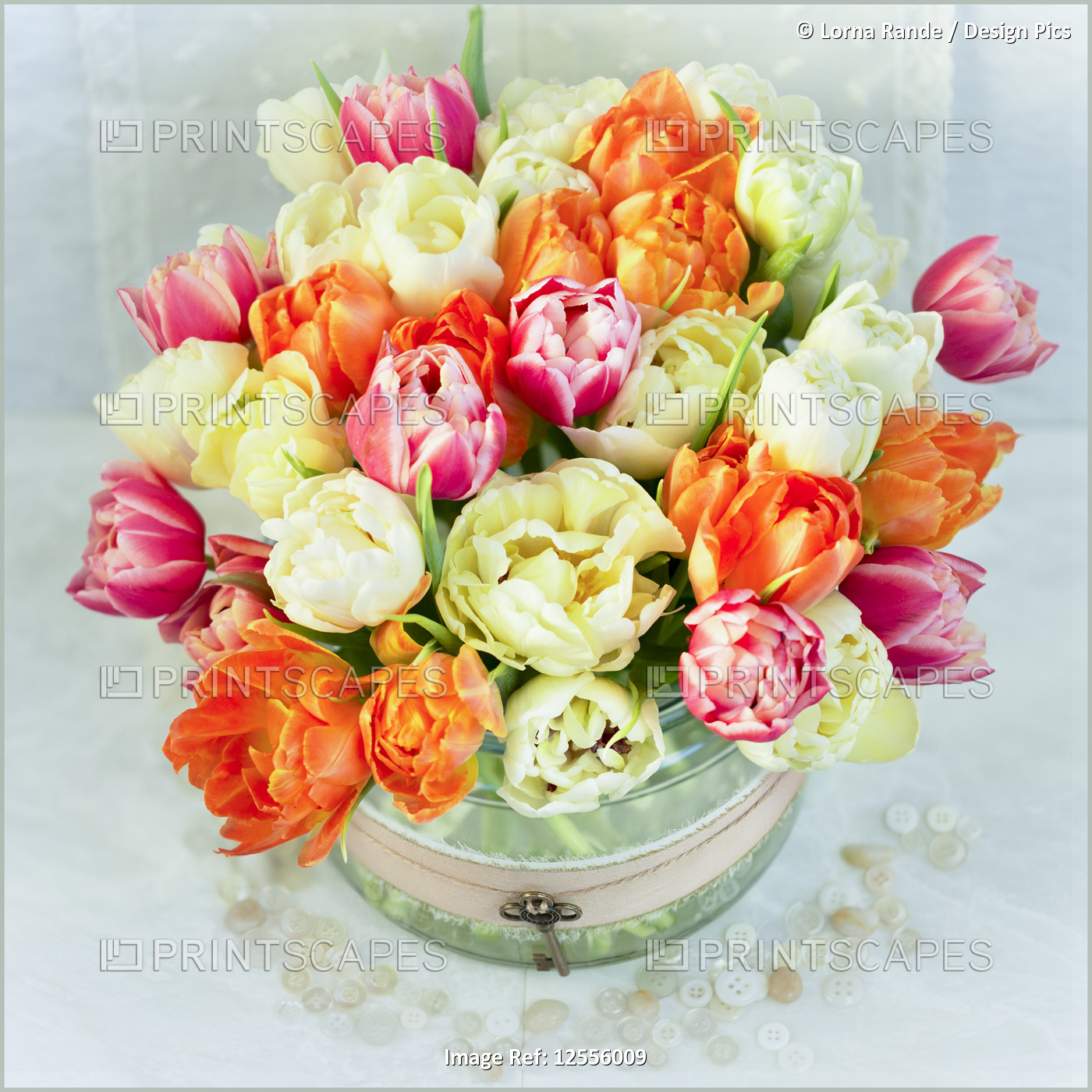 Bouquet of colourful flowers in a decorative container