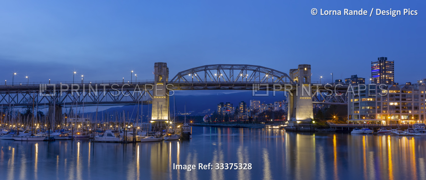 Granville Street Bridge to Granville Island at dusk; Vancouver, British ...