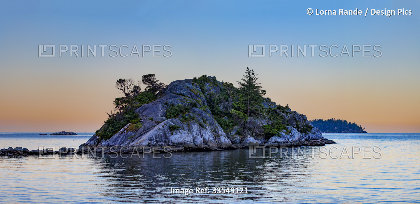 Small landform in the water at sunset in Whytecliff Park, Horseshoe Bay, BC, ...