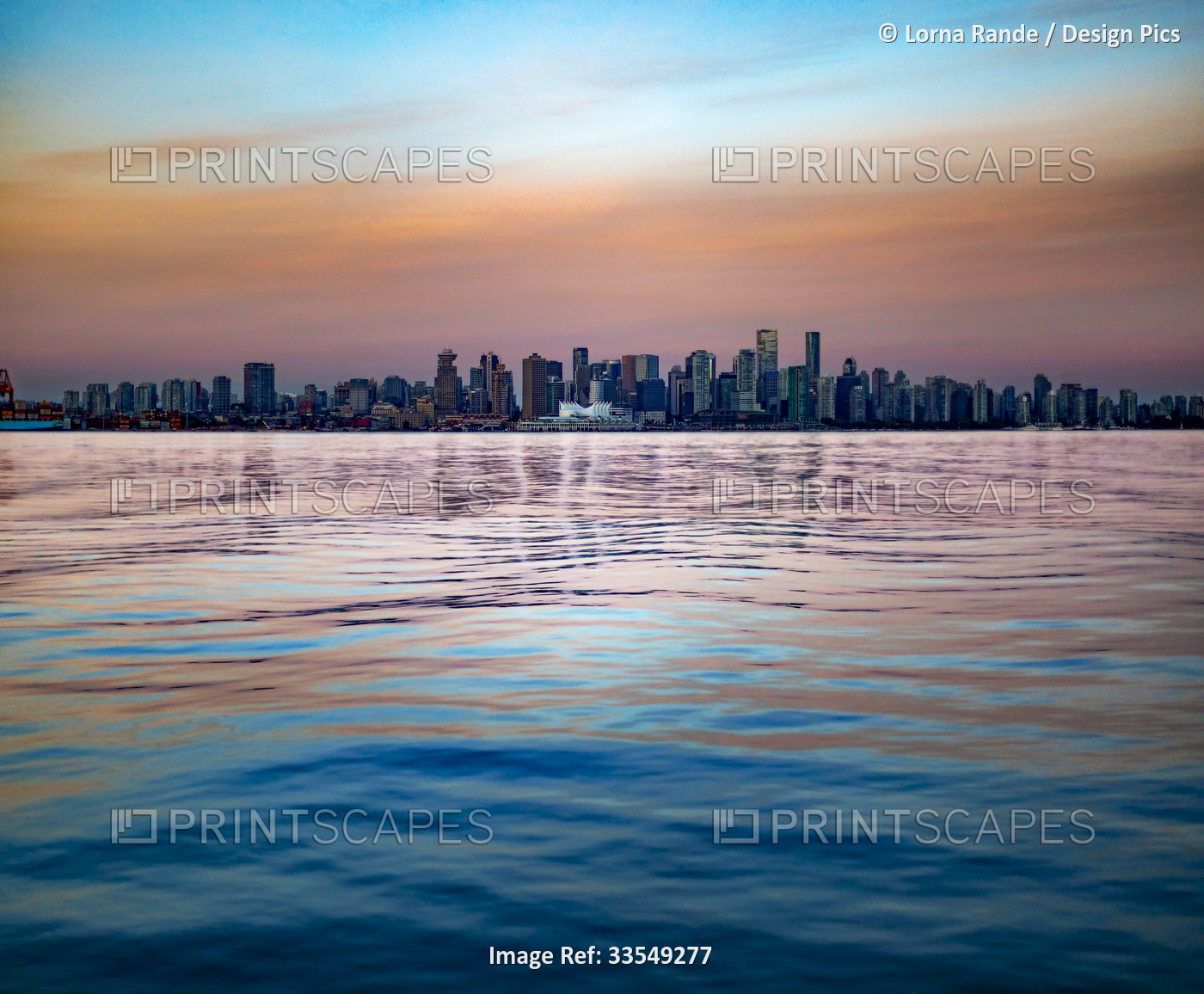 View of the downtown Vancouver skyline and waterfront with sunrise colours ...