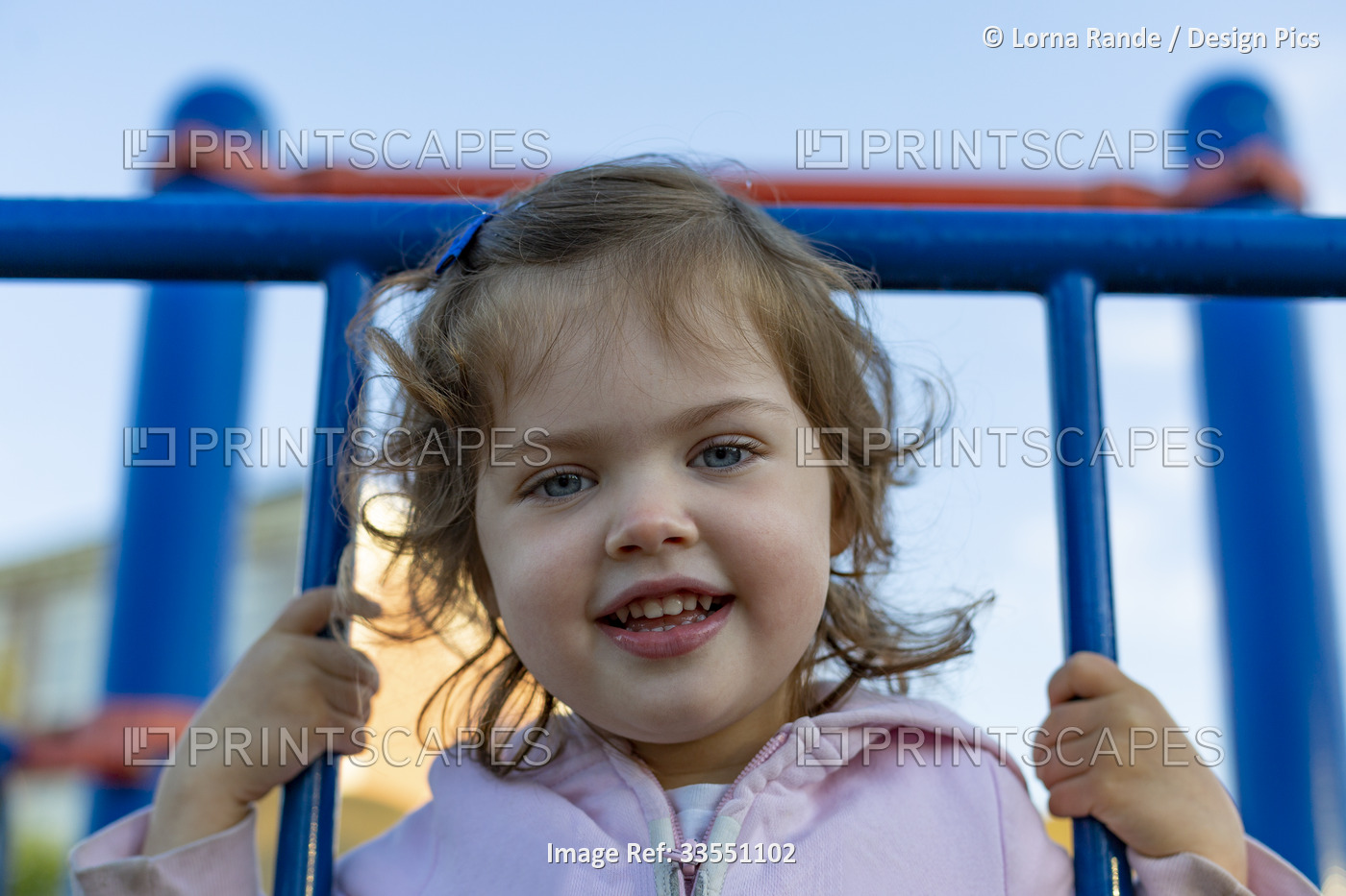 Portrait of a preschooler girl at the playground; North Vancouver, British ...