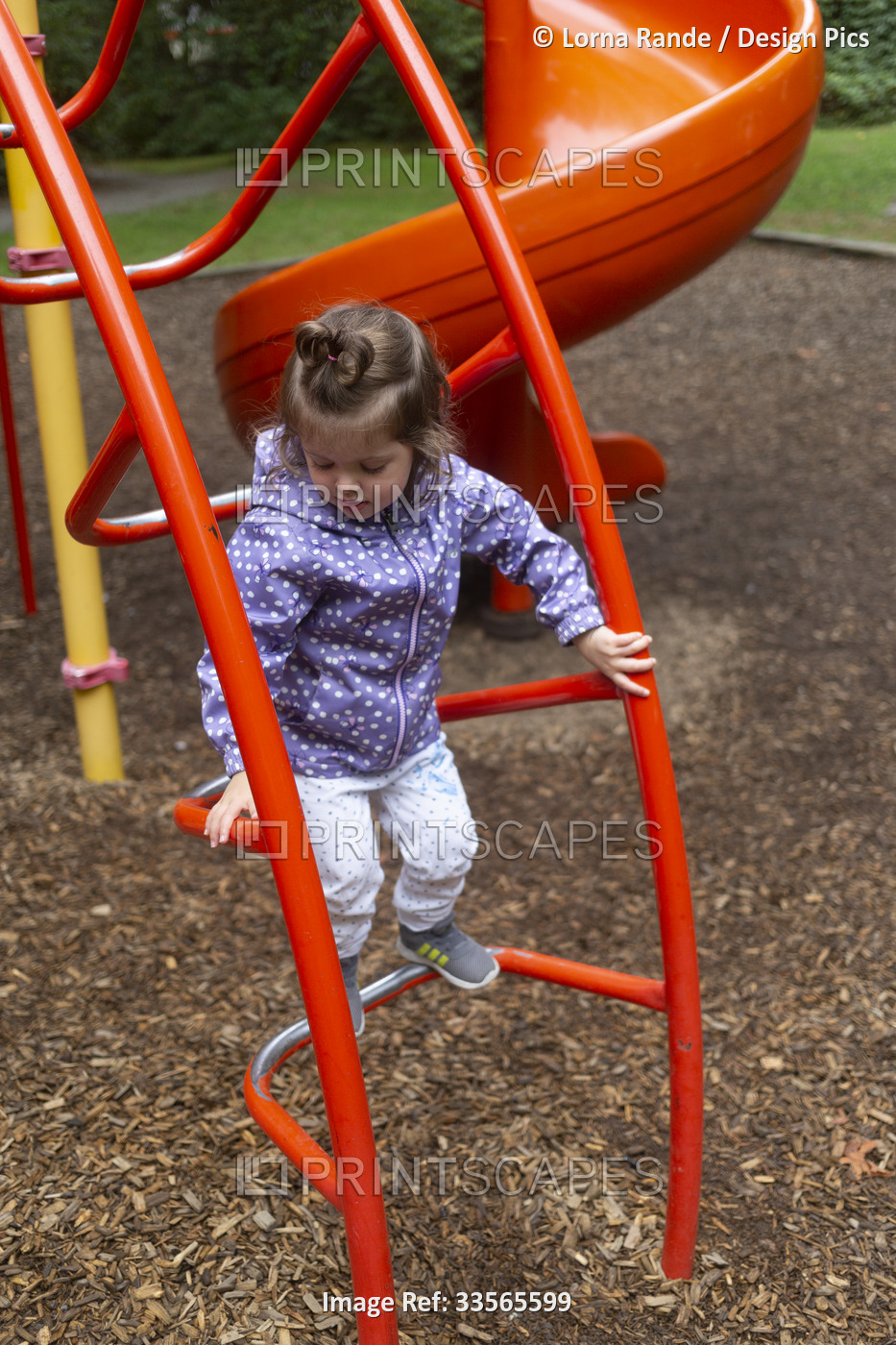 Preschool girl at a playground; North Vancouver, British Columbia, Canada
