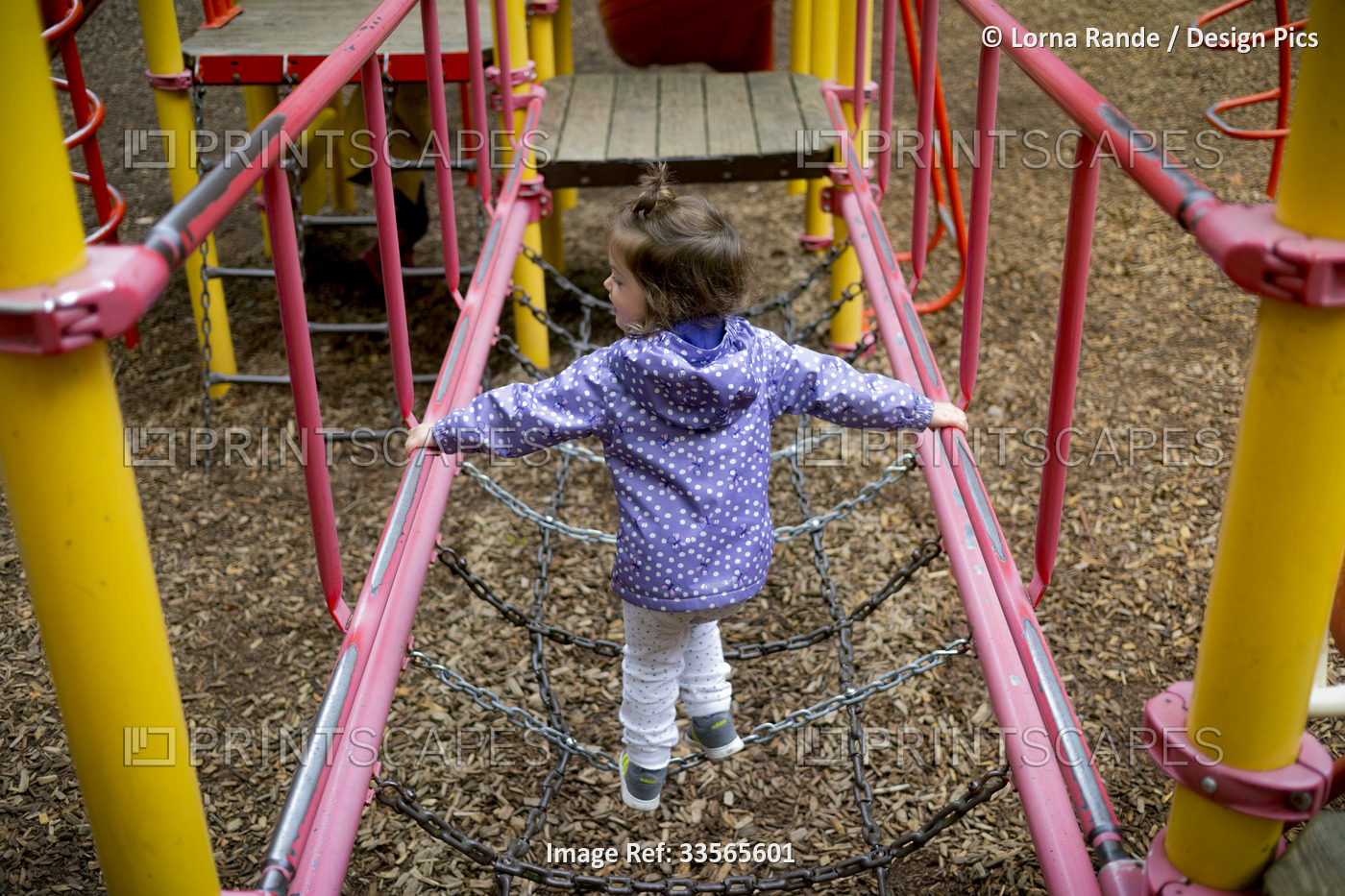 Preschool girl at a playground; North Vancouver, British Columbia, Canada