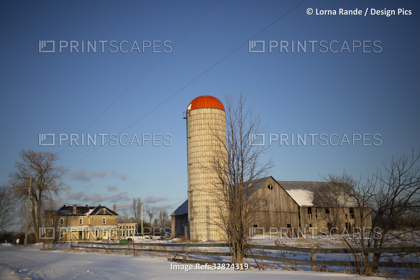 Farmstead in winter with a house, barn and silo in the Ottawa Valley; Ottawa ...