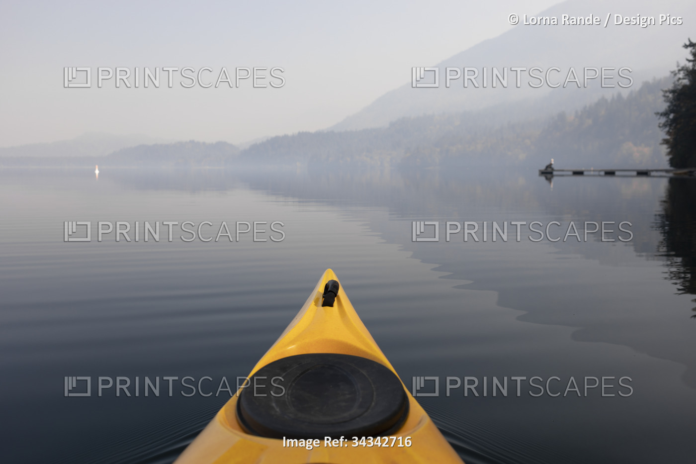 Kayaking on the tranquil water of Cultus Lake in Cultus Lake Provincial Park; ...