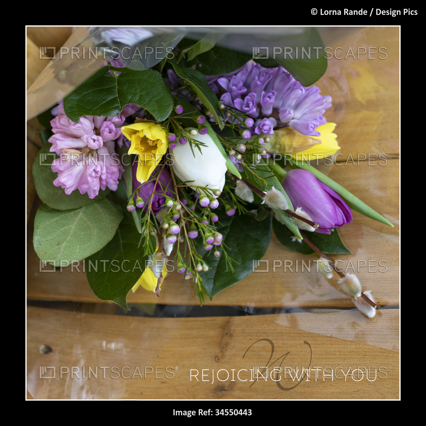 Colorful, spring bouquet to encourage on a wooden Adirondack chair background; ...